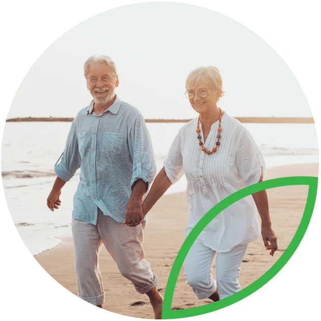 Retired couple on beach.