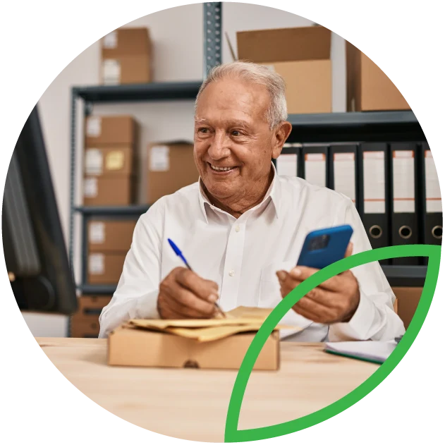 Business exit planning. Mature business owner working on computer.