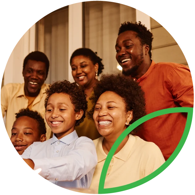 Estate planning. Family taking a photo together at dinner table.